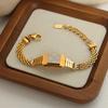 Retro Trendy Men's Bracelet: Shell Zircon Inlaid Titanium Steel Woven Chain, 18K Gold, Hong Kong Style Watch Shape.