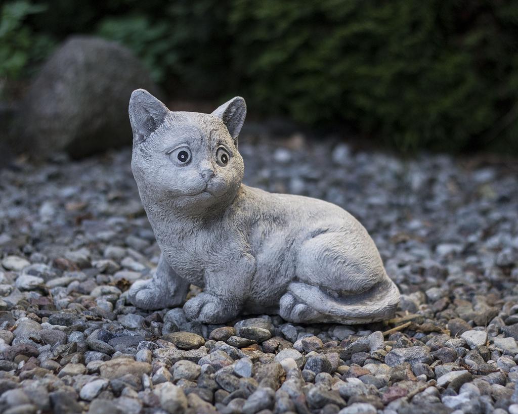 Decorative garden sculpture of a cat made of concrete