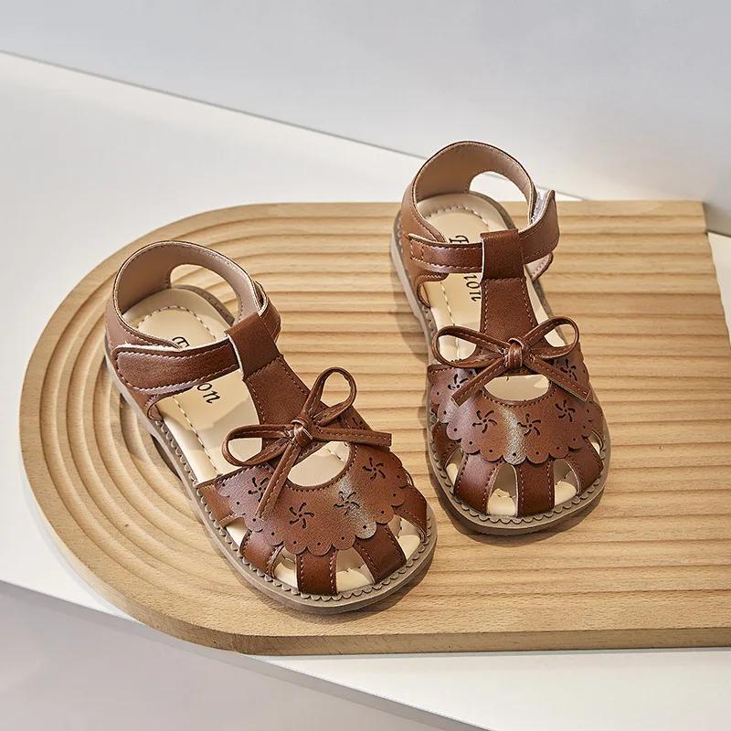 Kinder Prinzessinnenschuhe 2024 Sommer Neue Mädchen Sandalen mit Süßer Schleife Mädchen Hohle Strandschuhe für den Urlaub Vielseitige Mode Ballerinas