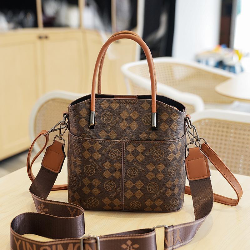 

Brown Monogram Tote Bag with Adjustable Strap and Metal Accents, Classic Beige Base for Stylish Daily Use