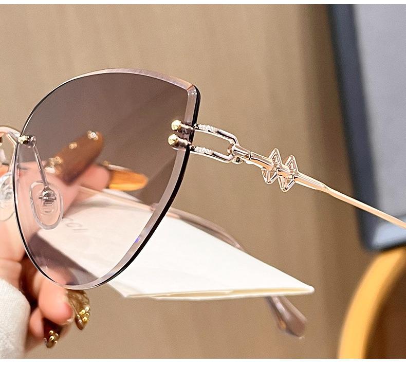 Women's Frameless Oval Metal Retro Sunglasses - High-End Japanese & Korean Fashion
