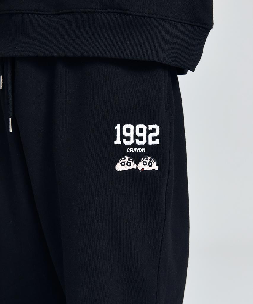 Daenkkomma Crayon Shin-Chan 1992 Face Embroidery Sweatpants (Black, Cream)