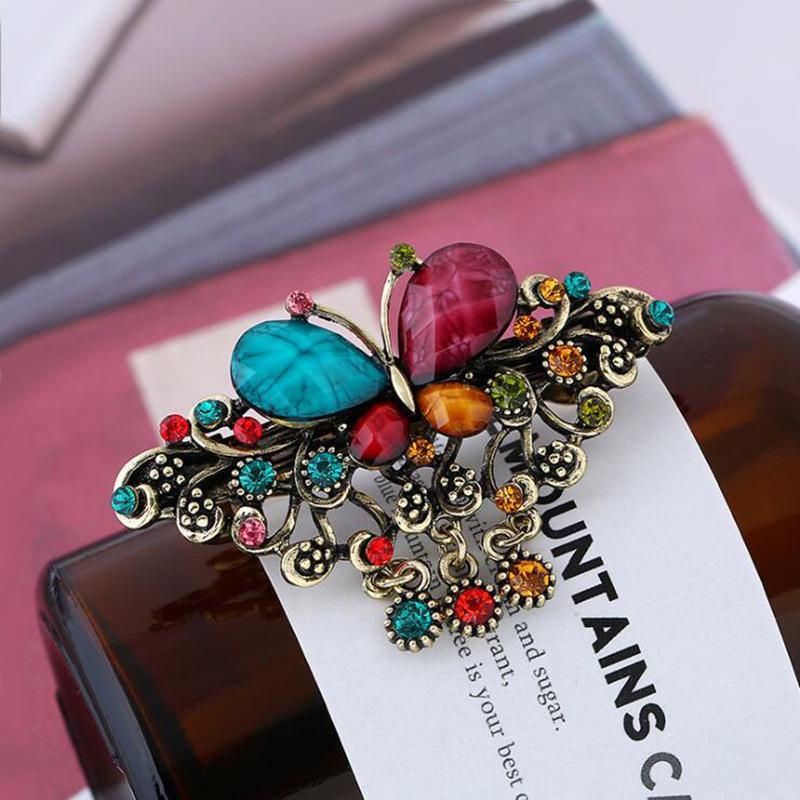 

Дитяча ретро шпилька для волосся з китицею та стразами у формі метелика