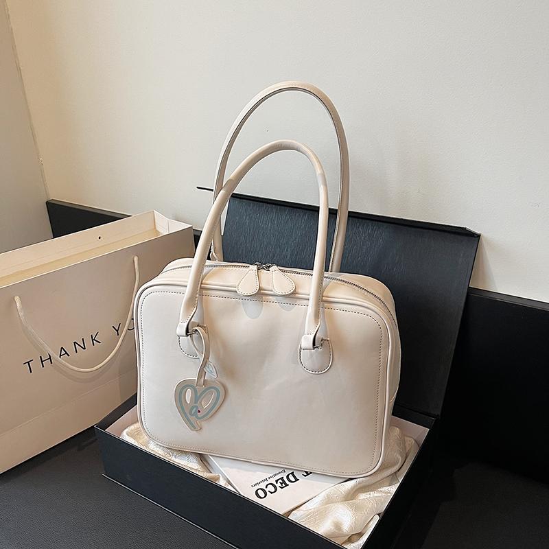 Nové podzimní dámské tašky s vysokou kapacitou a pokročilou texturou, jednobarevné, s dobrým vzhledem, jednoduché univerzální tašky přes rameno