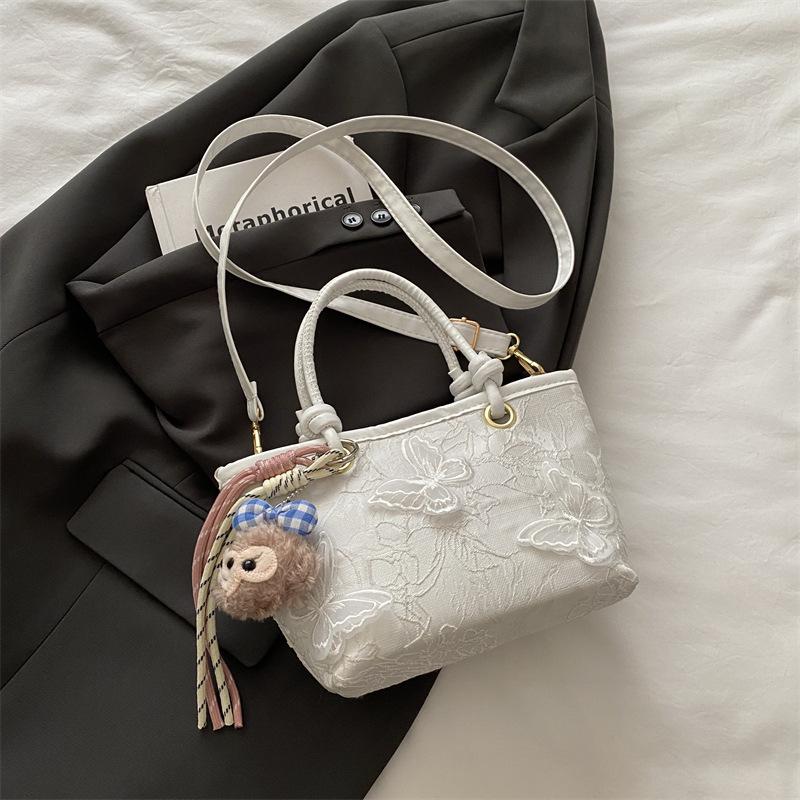 Super fire niche embroidered bag women's 2025 new summer versatile messenger bag fashionable portable bucket bag