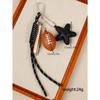 Cross-border hot-selling leather five-pointed star bag pendant camera baseball football DIY bag pendant keychain
