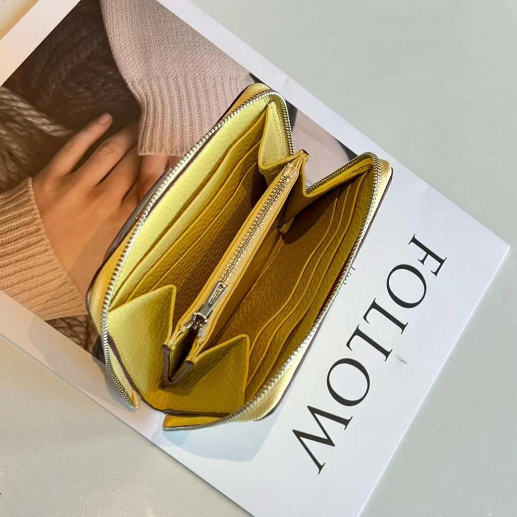 Nouveau petit sac à fermeture éclair en cuir de vachette première couche printemps 2026, portefeuille en cuir véritable, porte-monnaie en cuir souple, production et vente en gros par fabricant de Guangzhou