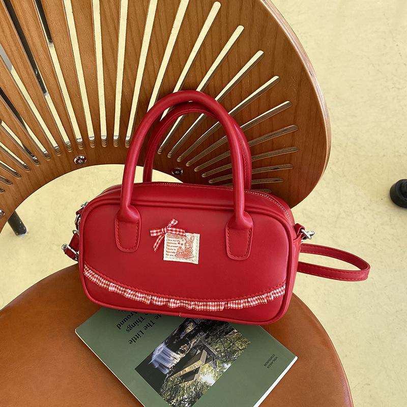 Korean ins hand-held bowling bag women's 2025 spring new fashion shoulder oblique span bag high-end small square bag