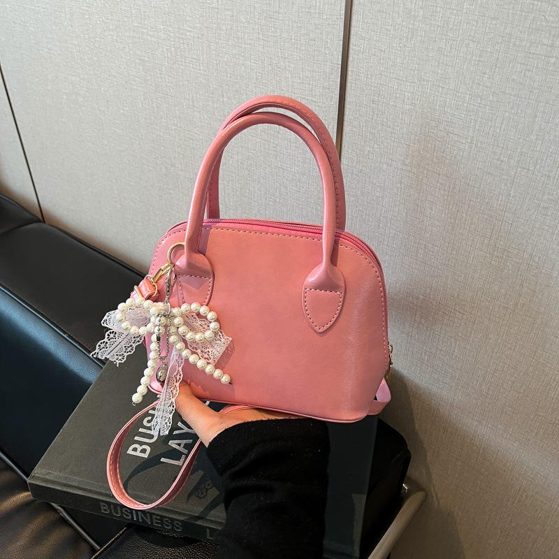 

Spring and summer popular beautiful handbag new fashion versatile messenger bag shoulder shell bag no pendant розовый