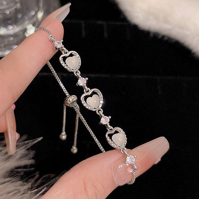 

Жемчужный браслет с цирконом в форме сердца для женщин Новое поступление Роскошный Изысканный Грация Банты Модный Универсальный Браслет Ручные украшения 1cm S415 silver [Cat s Eye Stone Heart bracelet]]