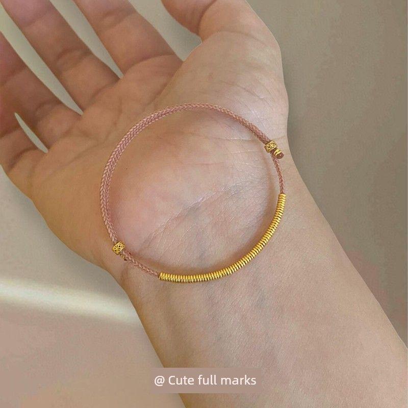 

New Chinese Style Pink Double-Layer Gold Circle Woven Carrying Strap National Style Simple and Versatile Stackable Hand Jewelry There is a golden hand rope every year.
