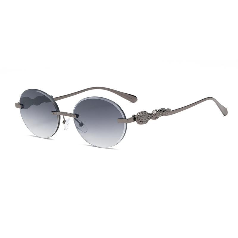 Europe and the United States gradual change frameless sunglasses oval frame fashion street shot anti-ultraviolet sunglasses retro trimmed sunshade gla
