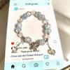 Weihnachts-Charm-Armband mit Crackle-Perlen, Schneeflocken-, Baum-, Weihnachtsmann- und Glockenanhängern