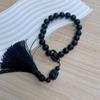 Obsidian Gradient Tassel Jade-Style Phone Charm with Antique Lion Dance Design