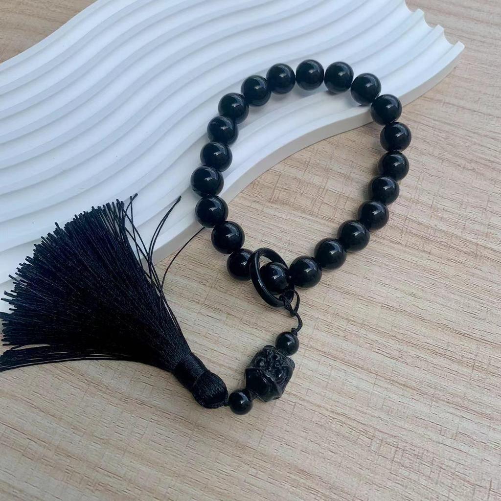 Obsidian Gradient Tassel Jade-Style Phone Charm with Antique Lion Dance Design