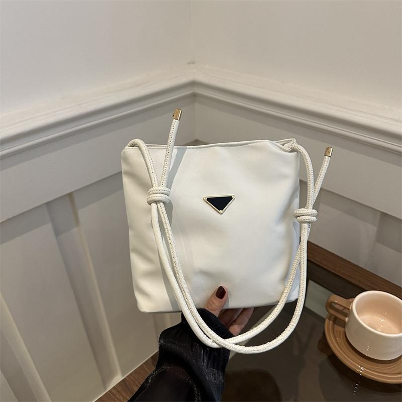 Black And Trendy White Bucket Bag With Unique Texture And Modern Design