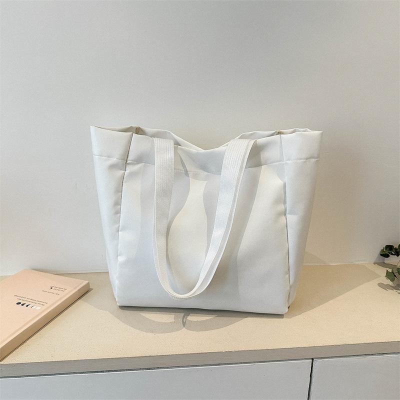 Bag women's new solid color large-capacity canvas shoulder bag simple commuter student tote bag shopping bag tide