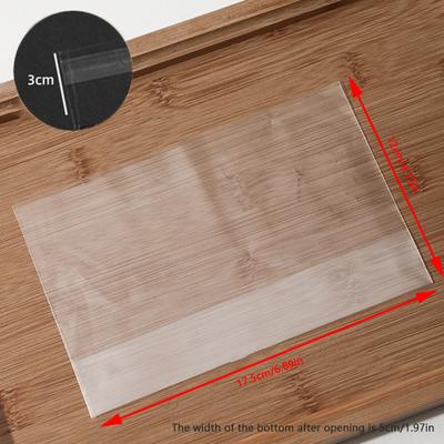 100Pcs Sacos de presente de doces descartáveis transparentes Saco de plástico de bolso plano Pão Torrada Biscoitos Assando Embalagem Saco Suprimentos Festa