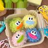 Vibrant Pompon Doll Keychain: Cute Cartoon Plush Toy & Backpack Charm