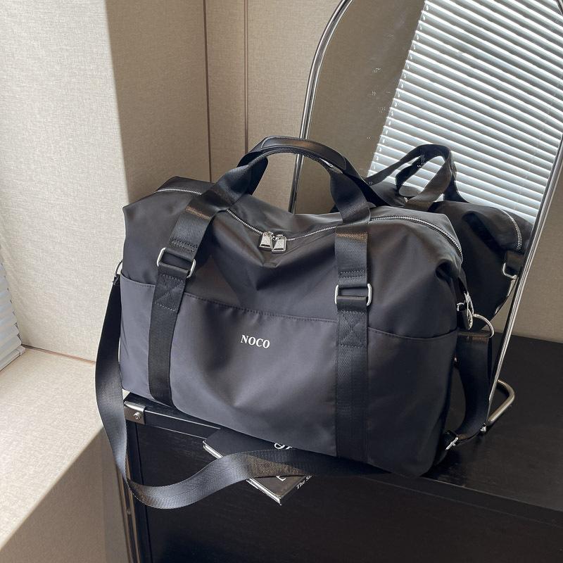 

Большая вместительная сумка 2024 года, новая повседневная ручная деловая дорожная сумка, женская универсальная сумка через плечо для путешествий на короткие расстояния чёрный