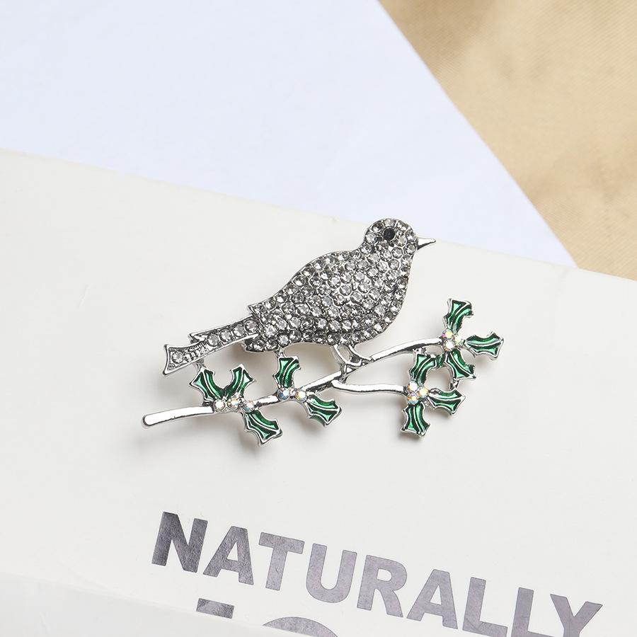 

Брошь «Ветка дерева и птица» One Size