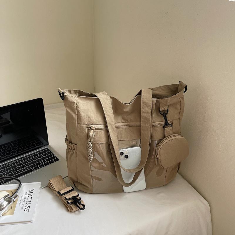 

Large-capacity casual tote bag women s 2025 summer new fashion simple commuter student class solid color shoulder bag хакі