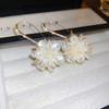 White pearl shell fringed earrings fashionable and elegant temperament earrings French light luxury high-end earrings women