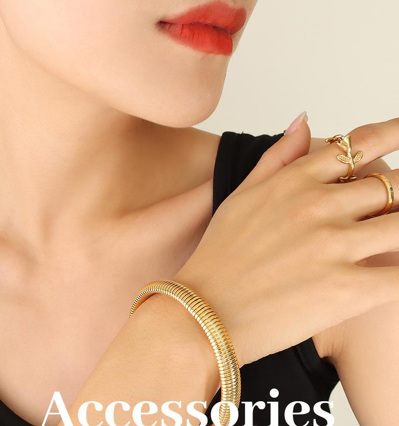 Retro Elastic Wide & Narrow Band Bracelet for Women - Gold-Plated Titanium Steel Fashion Bangle with French Personality Niche Design.