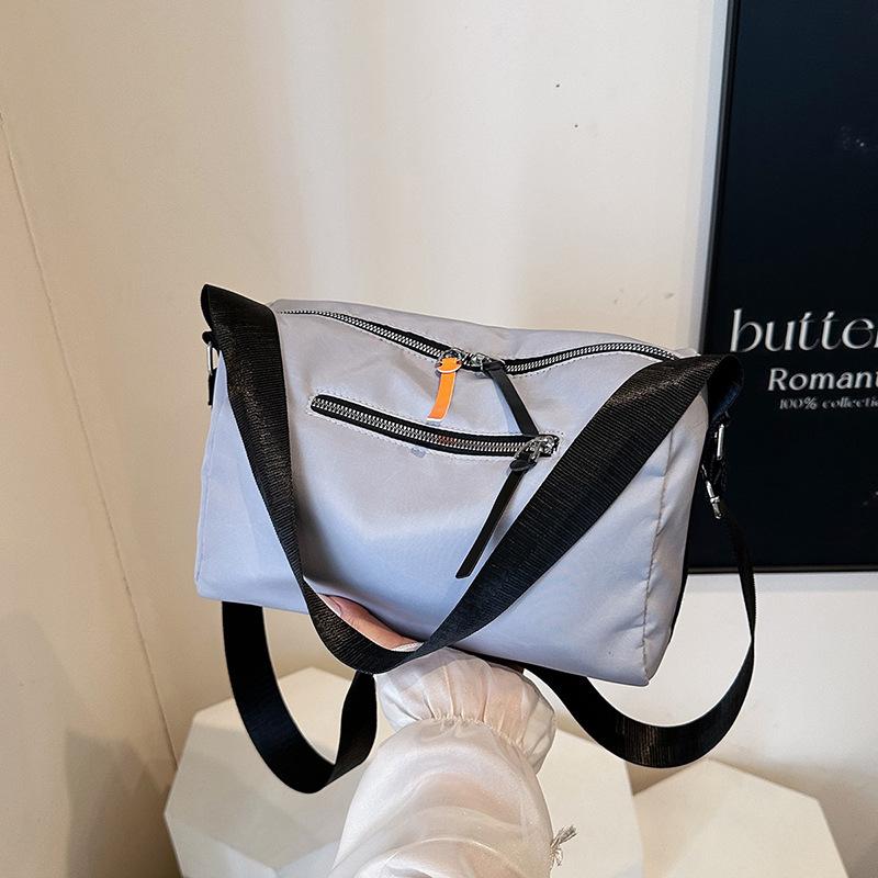 

Crossbody bag 2025 new nylon texture shoulder diagonal span bag waterproof large capacity fitness bag simple mother bag female серый