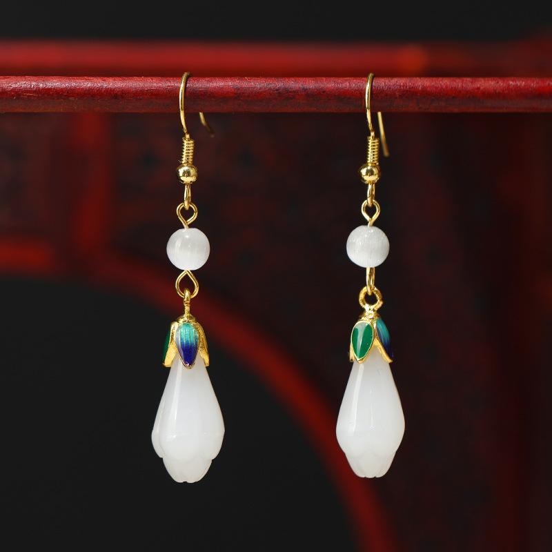 

Chinese style magnolia flower earrings women s new Chinese retro design sense fringed earrings simple cheongsam long earrings
