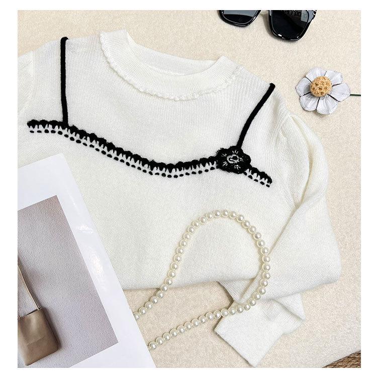 Elegant Women's Knit Top with White Lace Collar and Floral Brooch