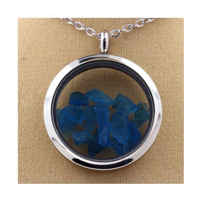 Pierres et Minéraux. Collier Apatite bleu neon brut. Modèle Médaillon 30 mm. Couleur Argent.