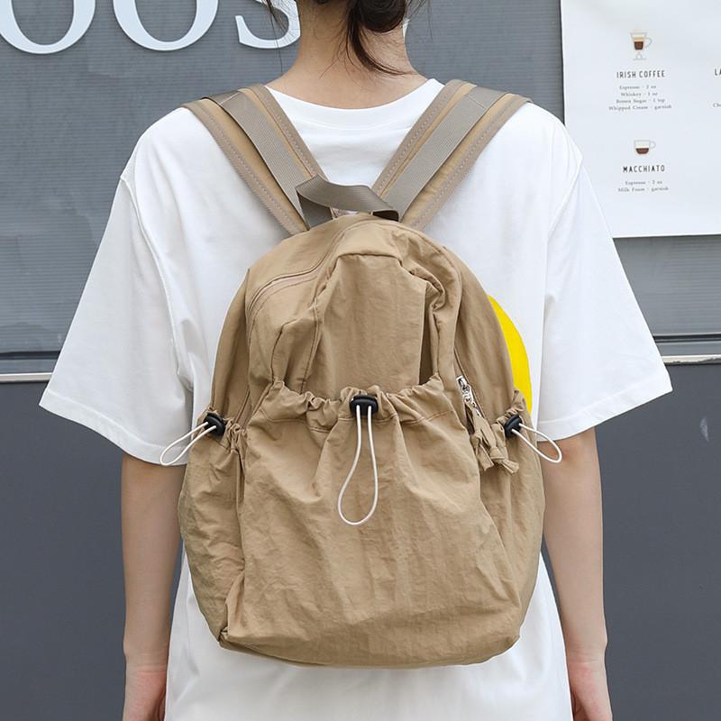 IELGY Korean version of casual literary canvas schoolbag, pleated nylon drawstring backpack, fashionable Oxford cloth backpack.