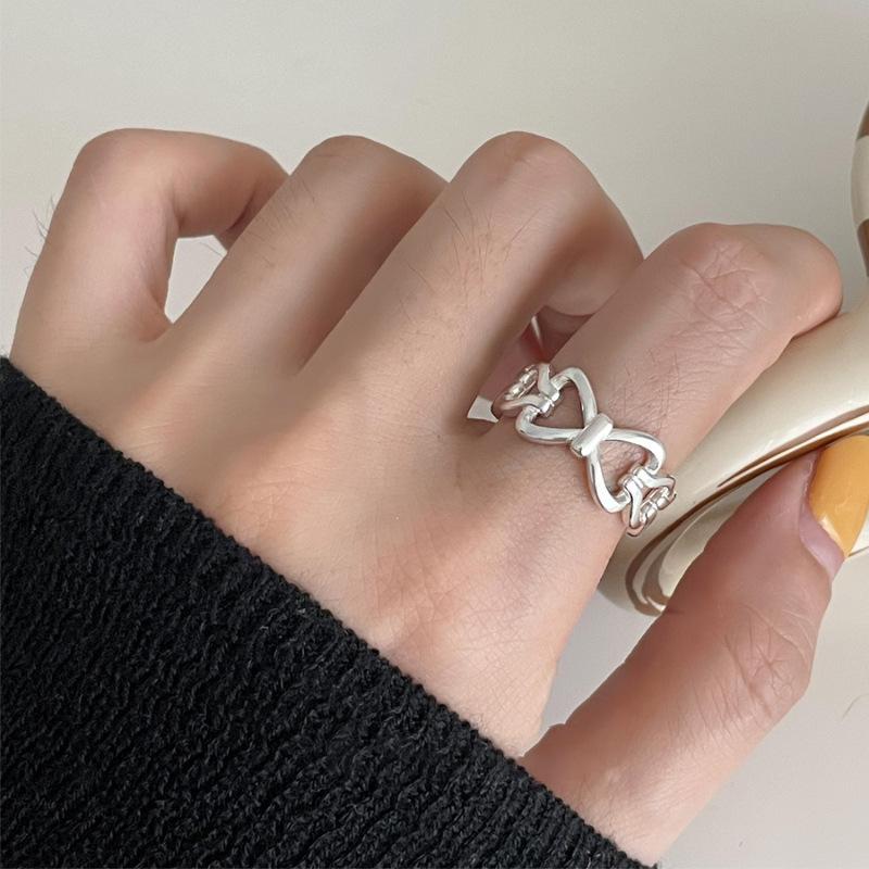 

PANJBJ 925 Sterling Silver White Cat Eye Stone Ring For Women Bowknot Hollow Out Sweet Romantic Fashion Jewelry Gift Dropship