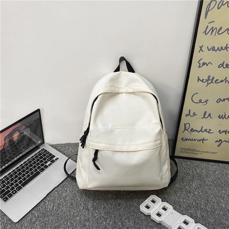 Simple and large-capacity unprinted backpack casual men's and women's same backpack junior high school solid color student schoolbag