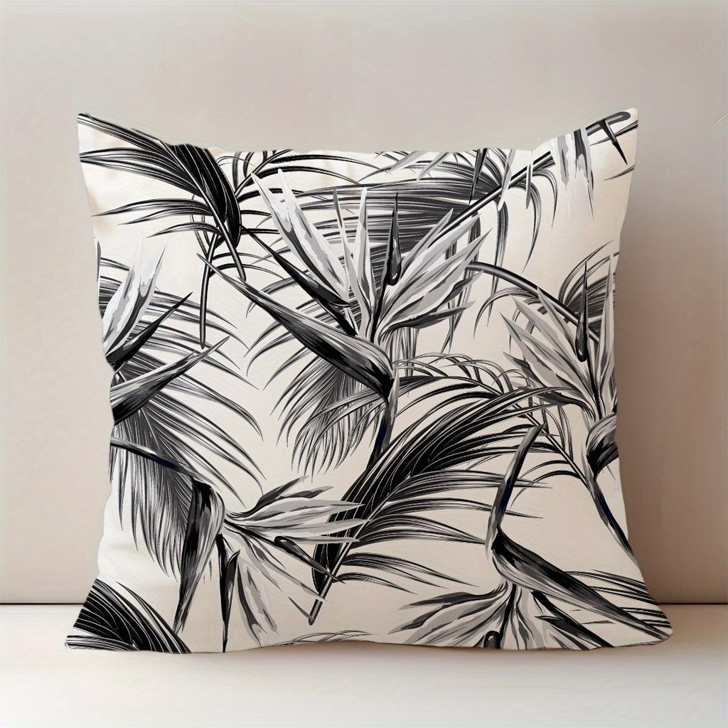 Black and white leaf print throw pillowcase, machine washable polyester material, suitable for living room and bedroom decor.