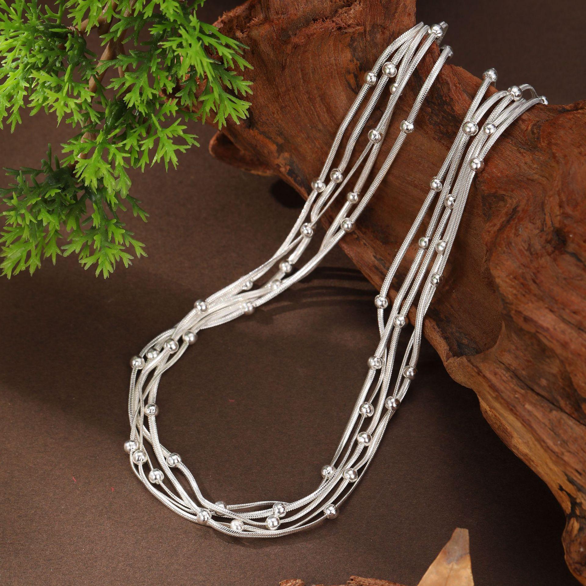 

Five-layer snake bone bead necklace, high-end stacking effect women s gold and silver two-color magnetic buckle neck chain
