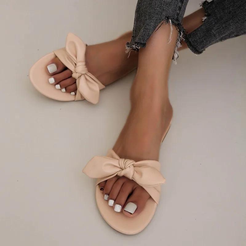 Модне взуття для жінок 2024 Гарячий розпродаж Жіночі шльопанці з відкритим носком Літні з бантом Однотонні Вуличні Повсякденні Пляжні Плоскі Зручні Шльопанці
