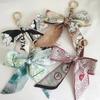 Women's Ribbon Bow  Fashion Weaving Silk Scarf Keychain Pendant Keyring Charm Bag Car Keychain Keychain Accessories