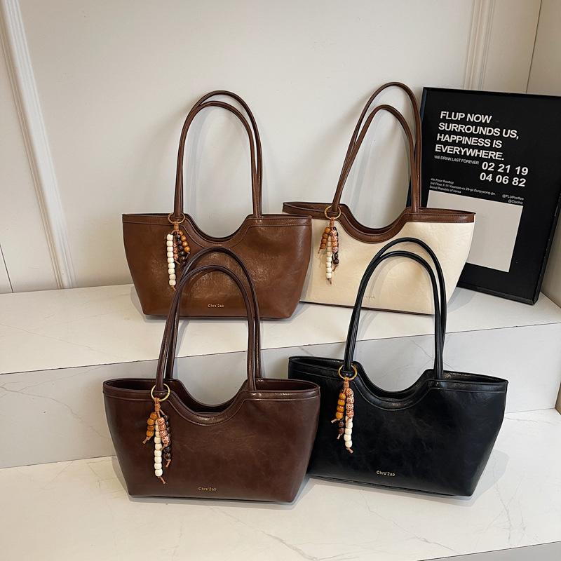 Large-capacity commuter tote bag women's 2025 autumn new retro handbag fashionable shoulder armpit bag