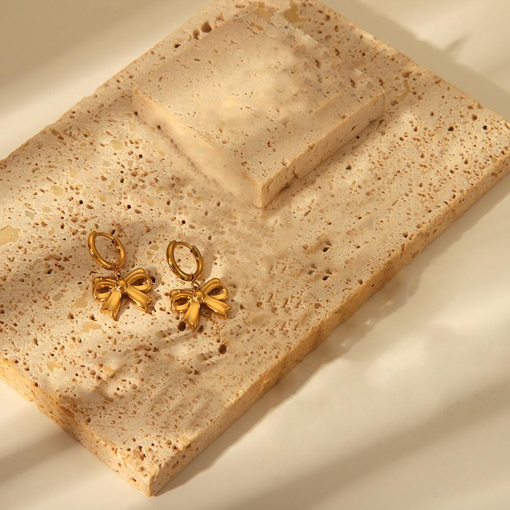 Chic Bow Coil Earrings: European & American Style In Stainless Steel