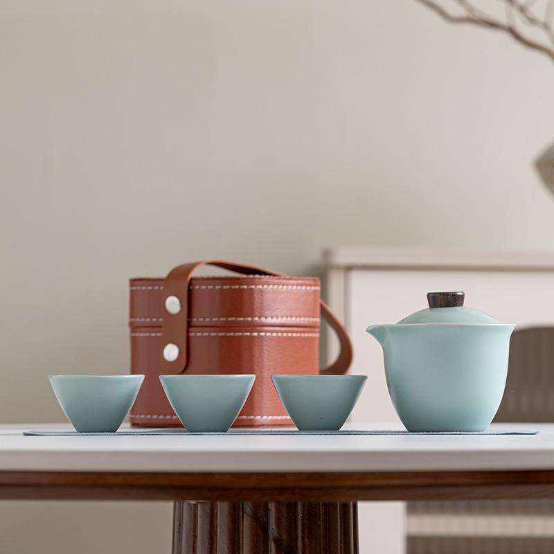 

Ceramic simple outdoor travel tea set, one pot, three cups, express cup, convenient storage bag, customized souvenir set.