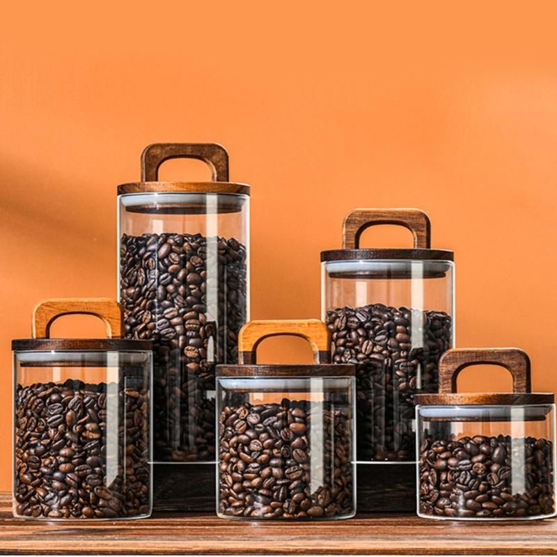 Vakuumversiegelter Vorratsbehälter aus klarem Glas mit Dichtungsdeckel und Holzgriff für Snacks und Zutaten