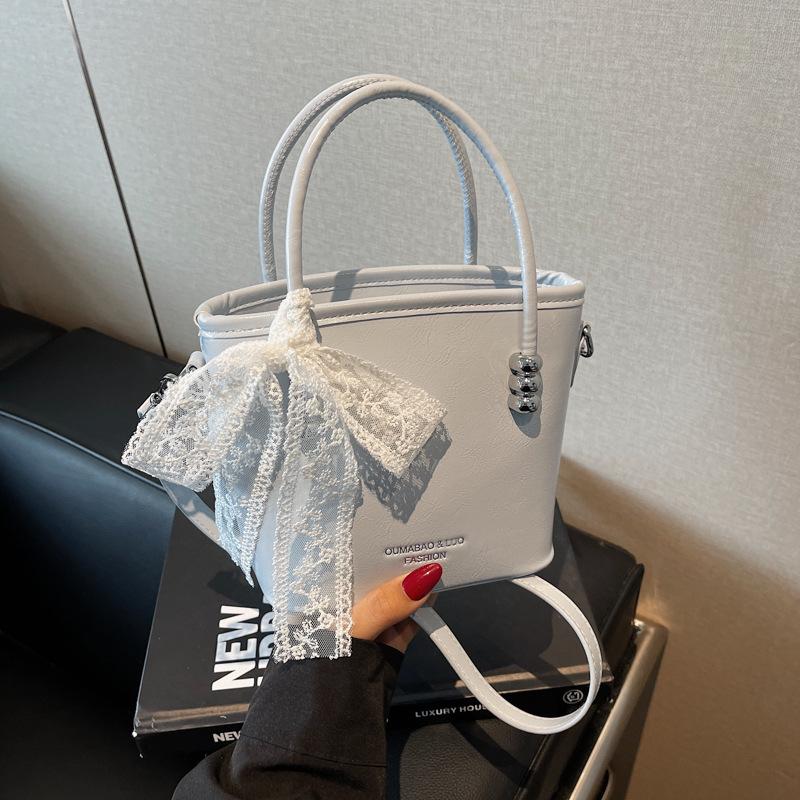 Hand carrying bucket bag women 2025 new shoulder bag simple casual niche messenger bag