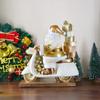 Golden Claus Riding A Motorcycle Figurine With Glowing LED Strip, A Christmas Home Decor Item For The Living Room.