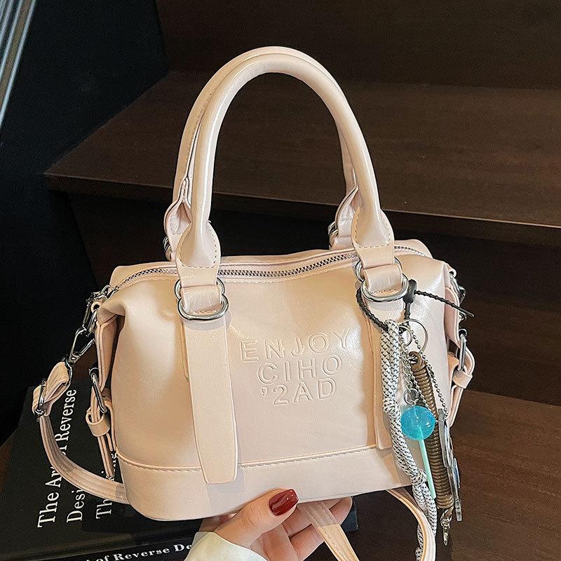 Korean Version of the New High-end College Temperament Portable Pillow Bag Women's Leisure Commuting Versatile Messenger Boston Bag