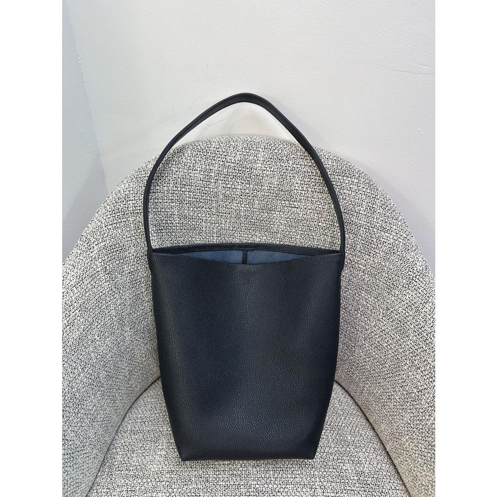 Nova bolsa de balde Row de grande capacidade em couro para mulher estilo minimalista TR com padrão de lichia bolsa tote portátil de ombro para o dia a dia