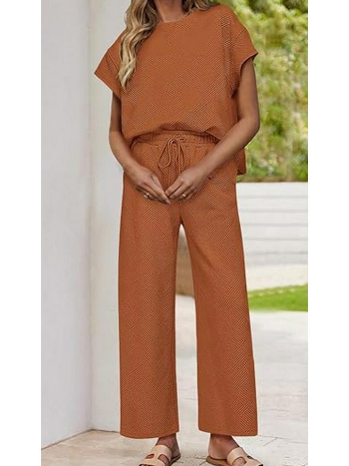 

Женский повседневный летний комплект из 2 предметов: Топ с коротким рукавом и брюки-клеш для путешествий и отпуска Small оранжевый