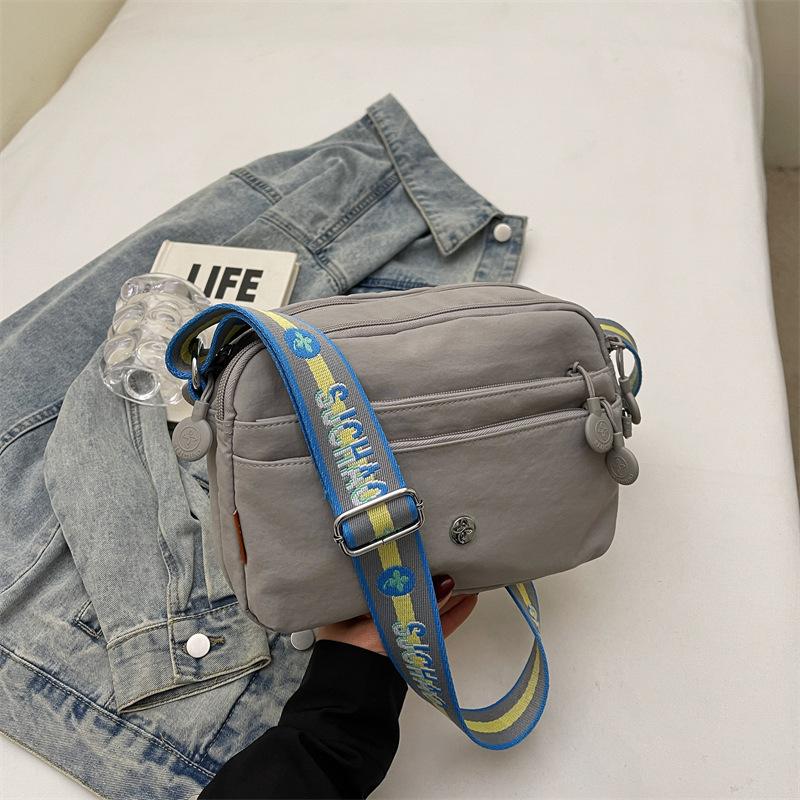 

Women s bag Classic versatile close-fitting small backpack Waterproof Oxford cloth shoulder messenger bag Multi-pocket travel bag серый