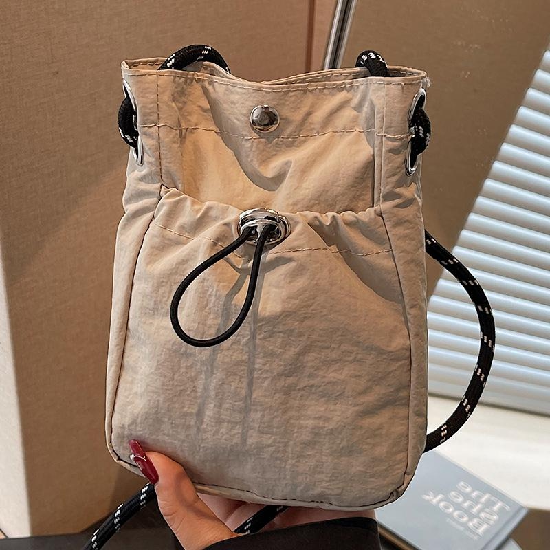 Summer new literary single shoulder messenger bag drawstring small bag niche fashion lightweight mobile phone nylon bag women